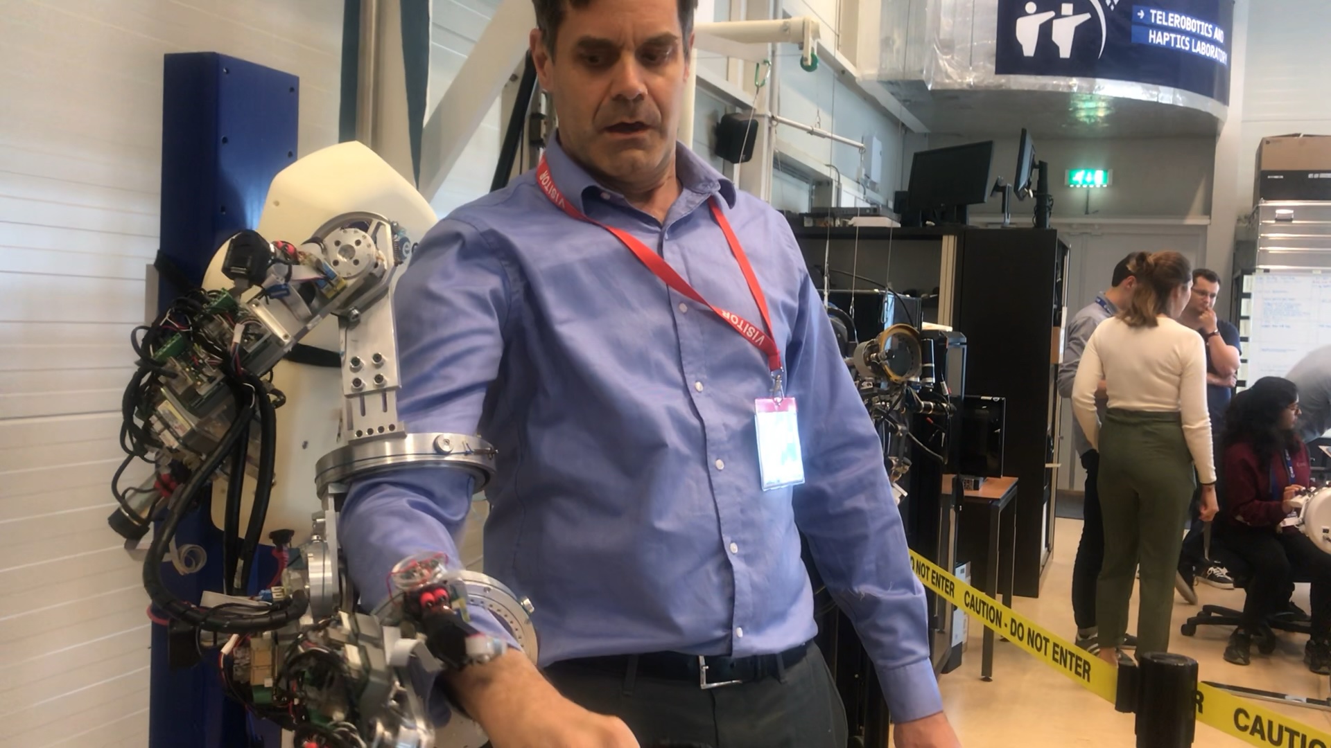 person with robotic arm exoskeleton