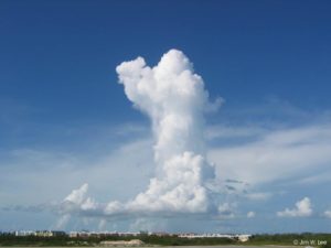 column of cloud rises above landscape