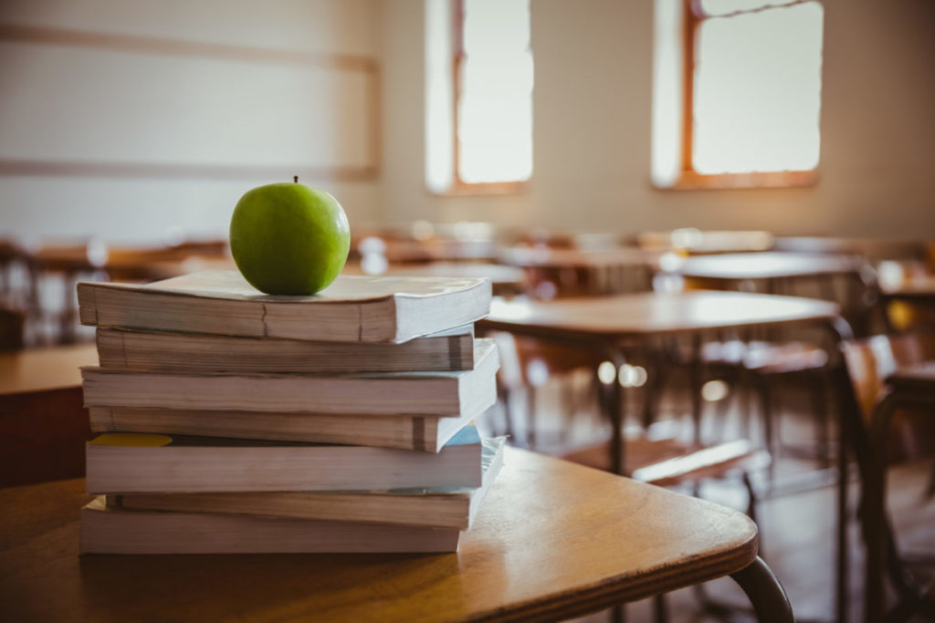 Apple on stack of books